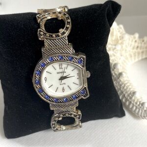 New silver cuff watch with blue stone horseshoe face